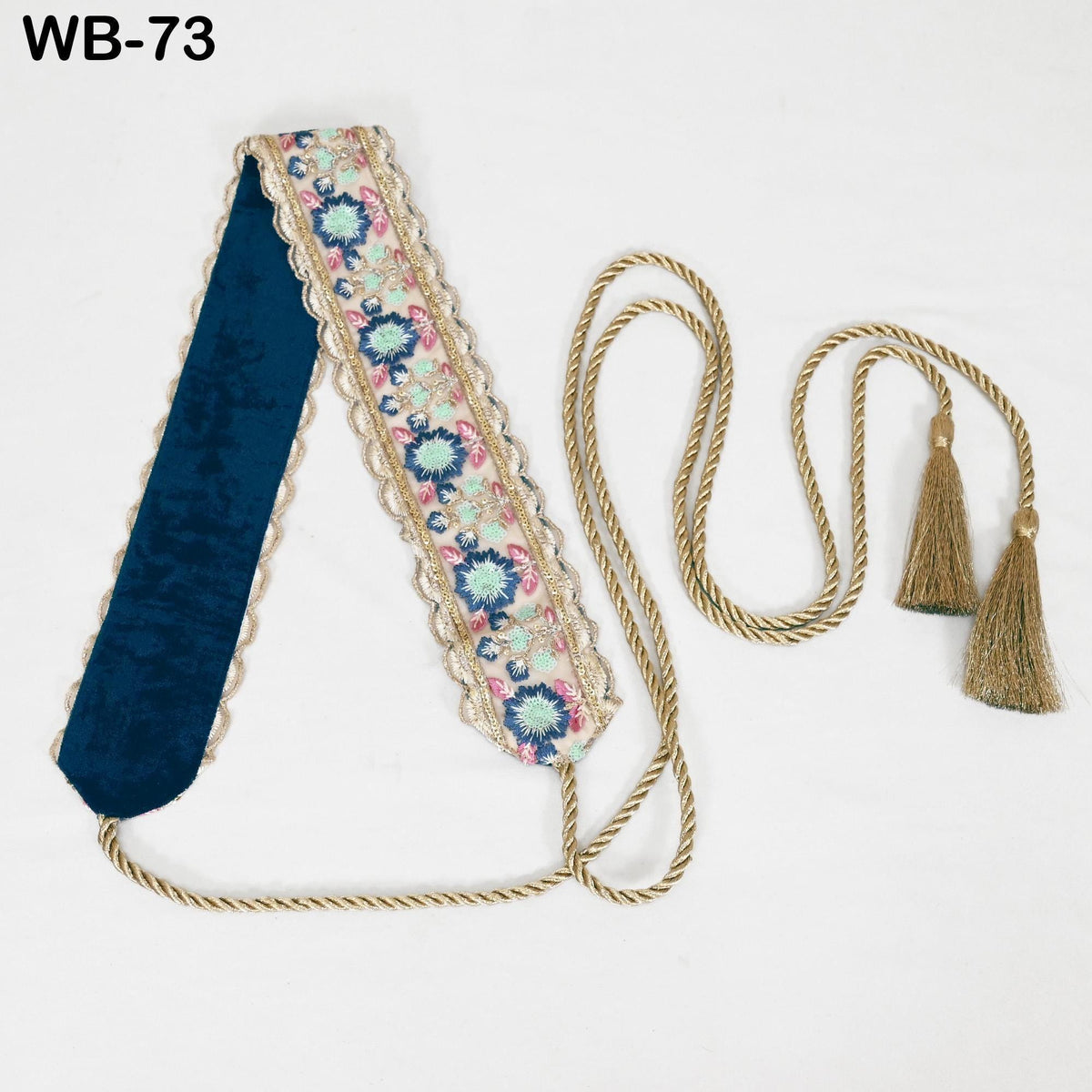 a decorative item with a floral pattern and tassels, placed on a white background.