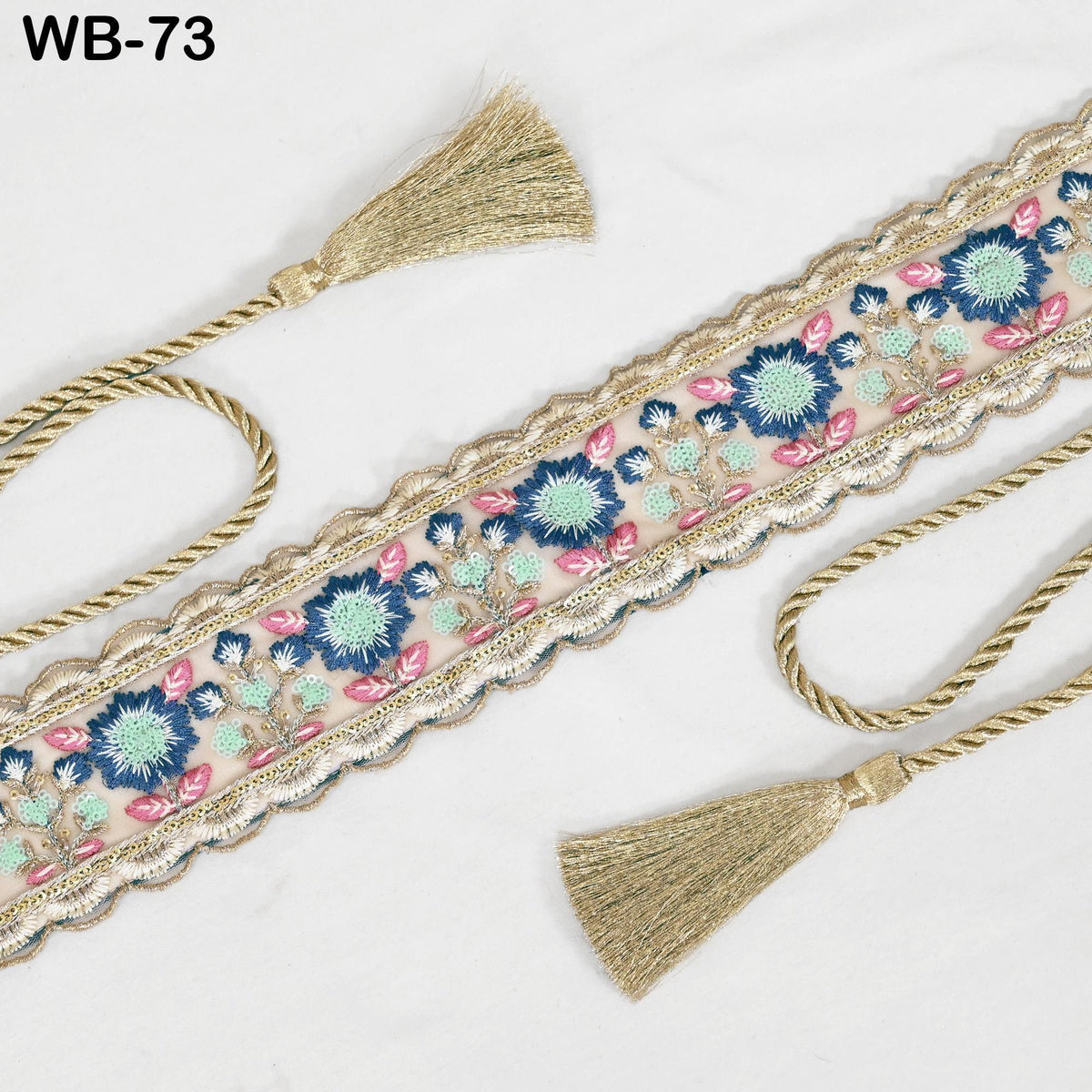a decorative border with a floral pattern and tassels, placed on a white background.