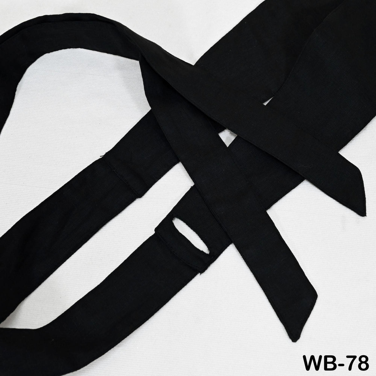 A close-up image of a black tie with a white background.