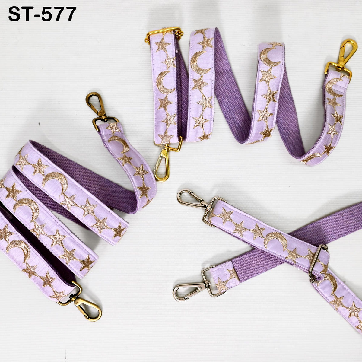 a collection of purple straps with gold star and crescent designs, arranged on a white background.