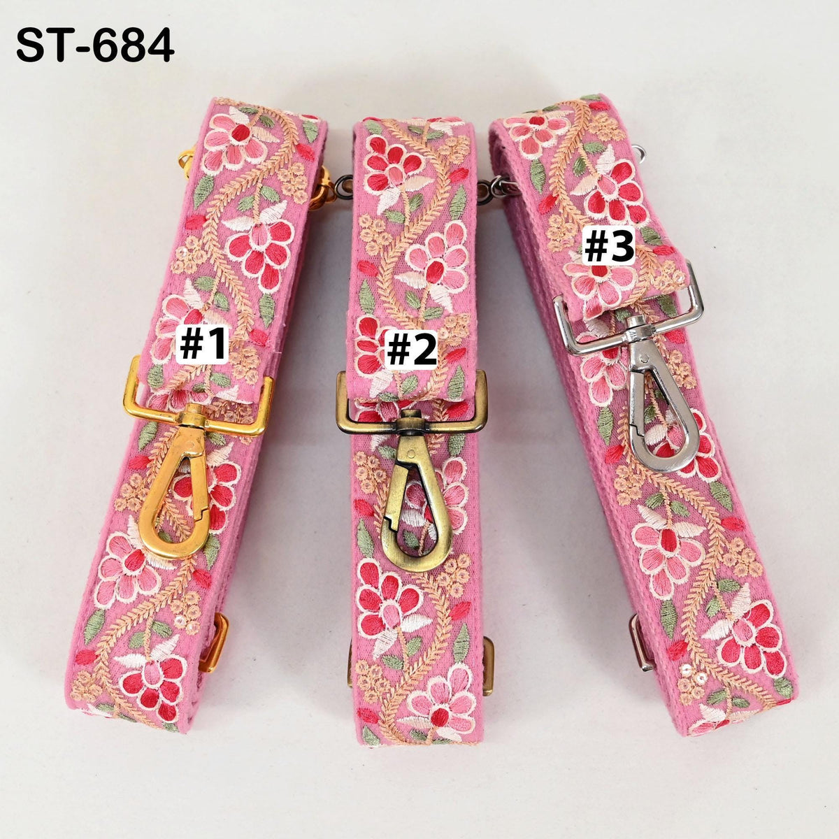 Three pink floral straps with gold hardware, each labeled with a number.
