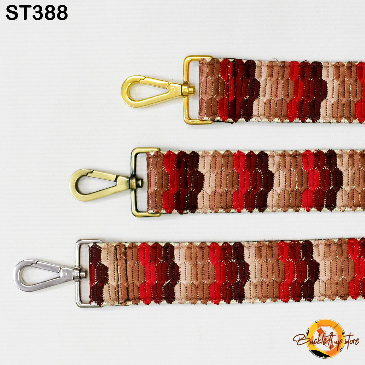 three colorful straps with metal hooks, arranged in a row against a white background.