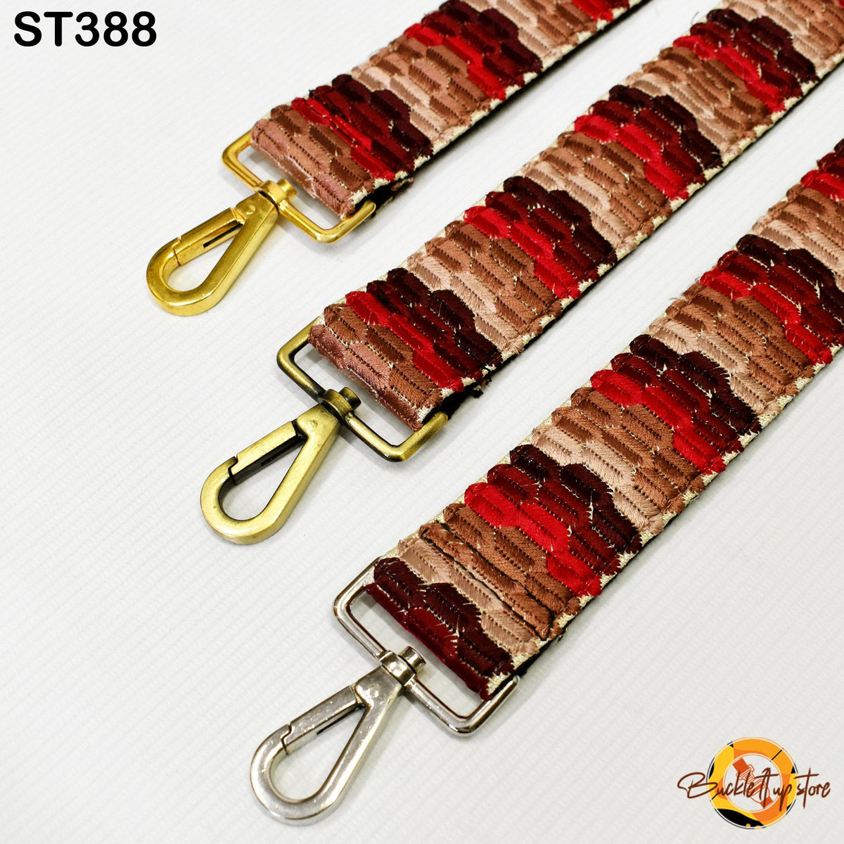 Three colorful straps with gold and silver metal hooks, arranged in a row on a white background.