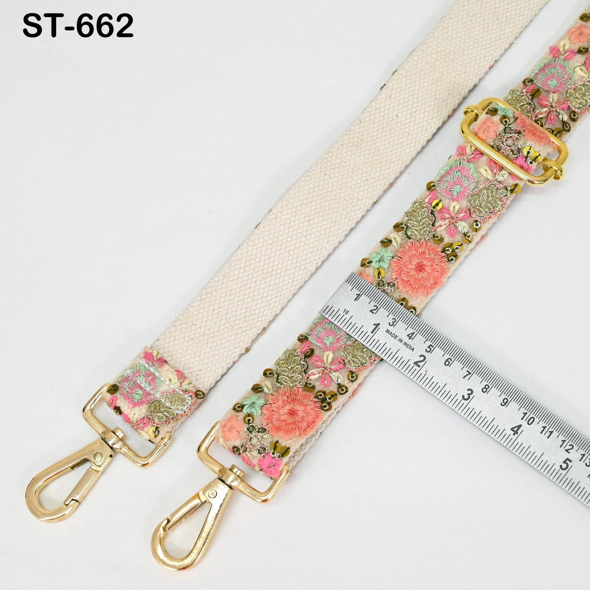 a floral-patterned strap with a ruler placed next to it, indicating the strap's size.