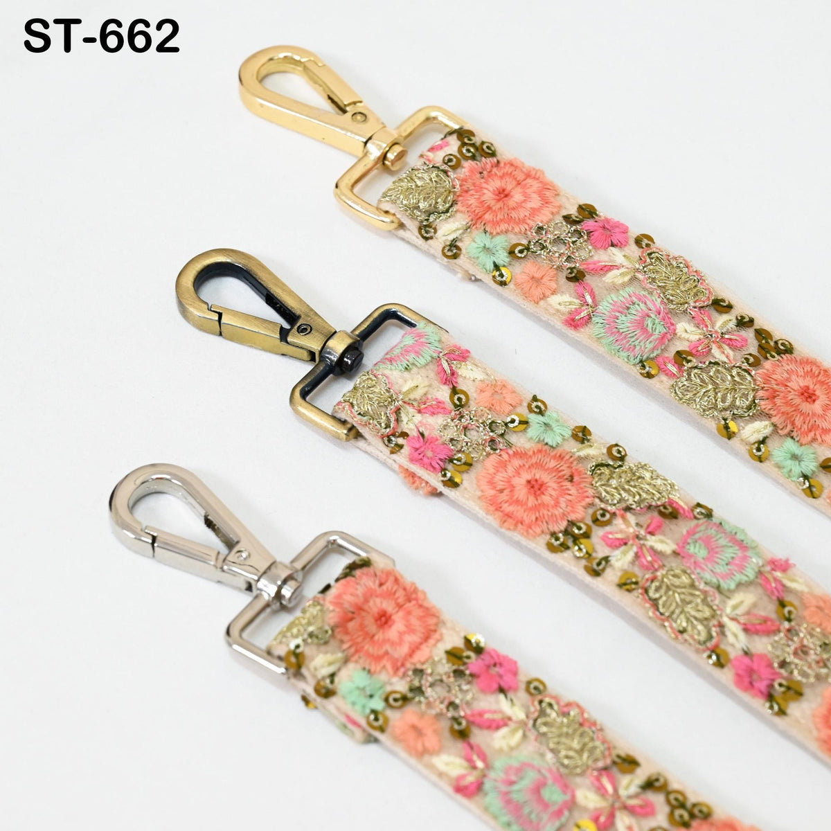 three different straps with floral embroidery and metal hooks.