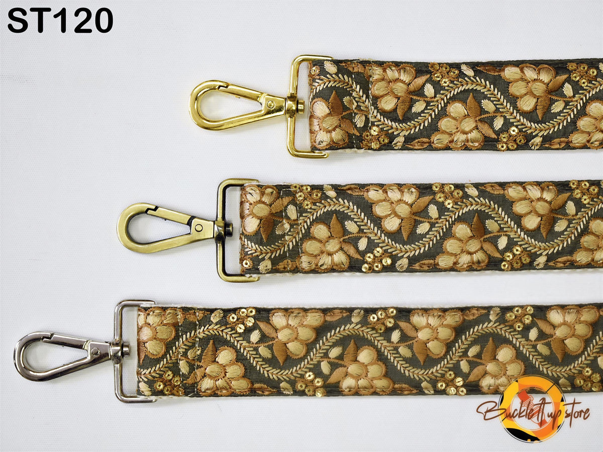 three straps with a floral pattern, each with a gold metal clasp and a silver metal attachment.