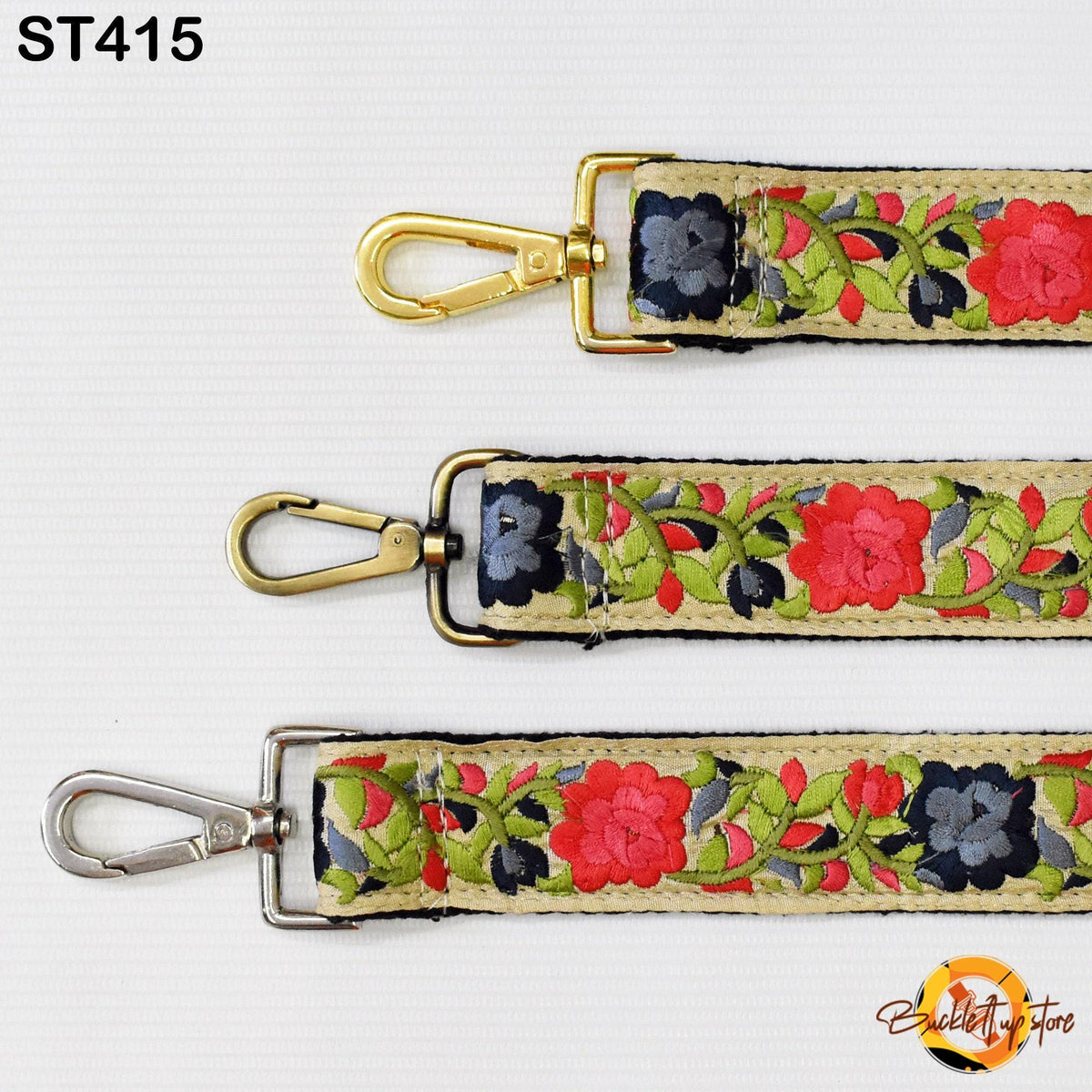three different straps with floral embroidery patterns in red, green, and blue colors. The straps have metal hooks and buckles, and the straps are arranged in a row on a white background.