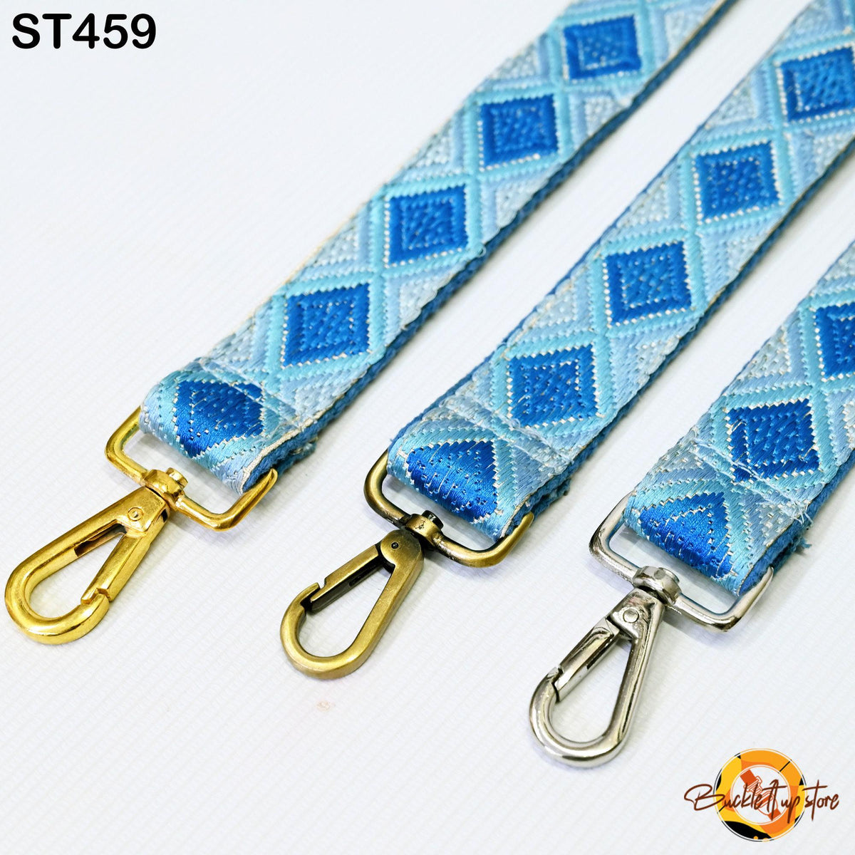 three colorful straps with metal hooks, arranged side by side.