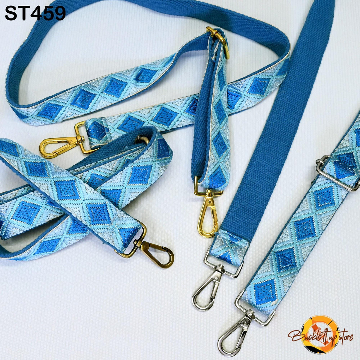 a collection of blue and white patterned straps with metal hooks, arranged on a white background.