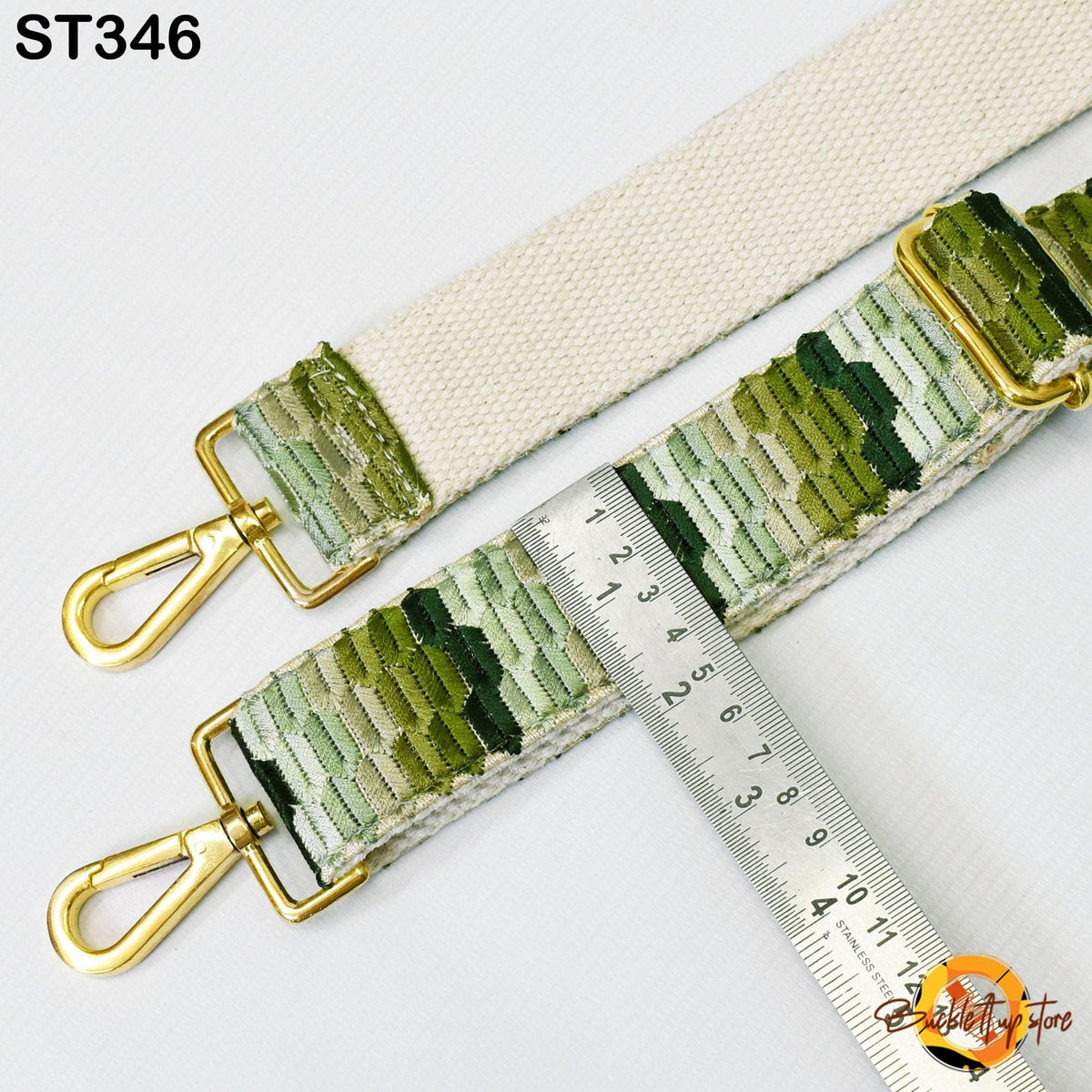 a strap with a ruler placed on it, indicating the strap's length.
