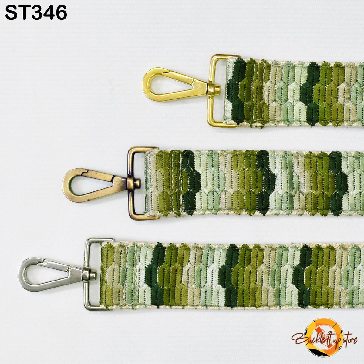 three different straps with metal hooks and a patterned fabric.