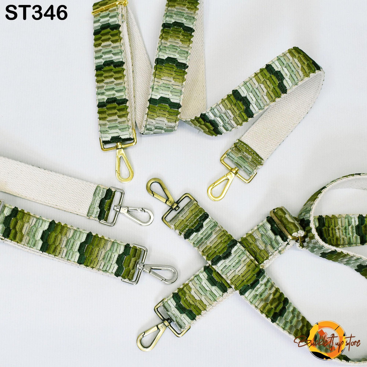 a collection of green and white patterned straps, including a strap with a metal clasp and several straps with metal clasps.