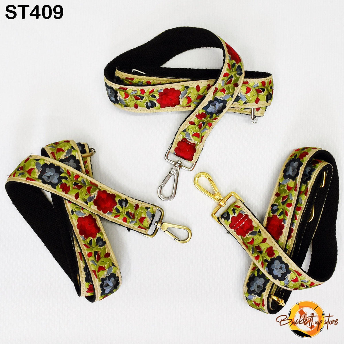 three colorful floral-patterned straps, each with a metal clasp and buckle. The straps are arranged in a triangular formation, with one strap on top, one on the bottom, and one in the middle.