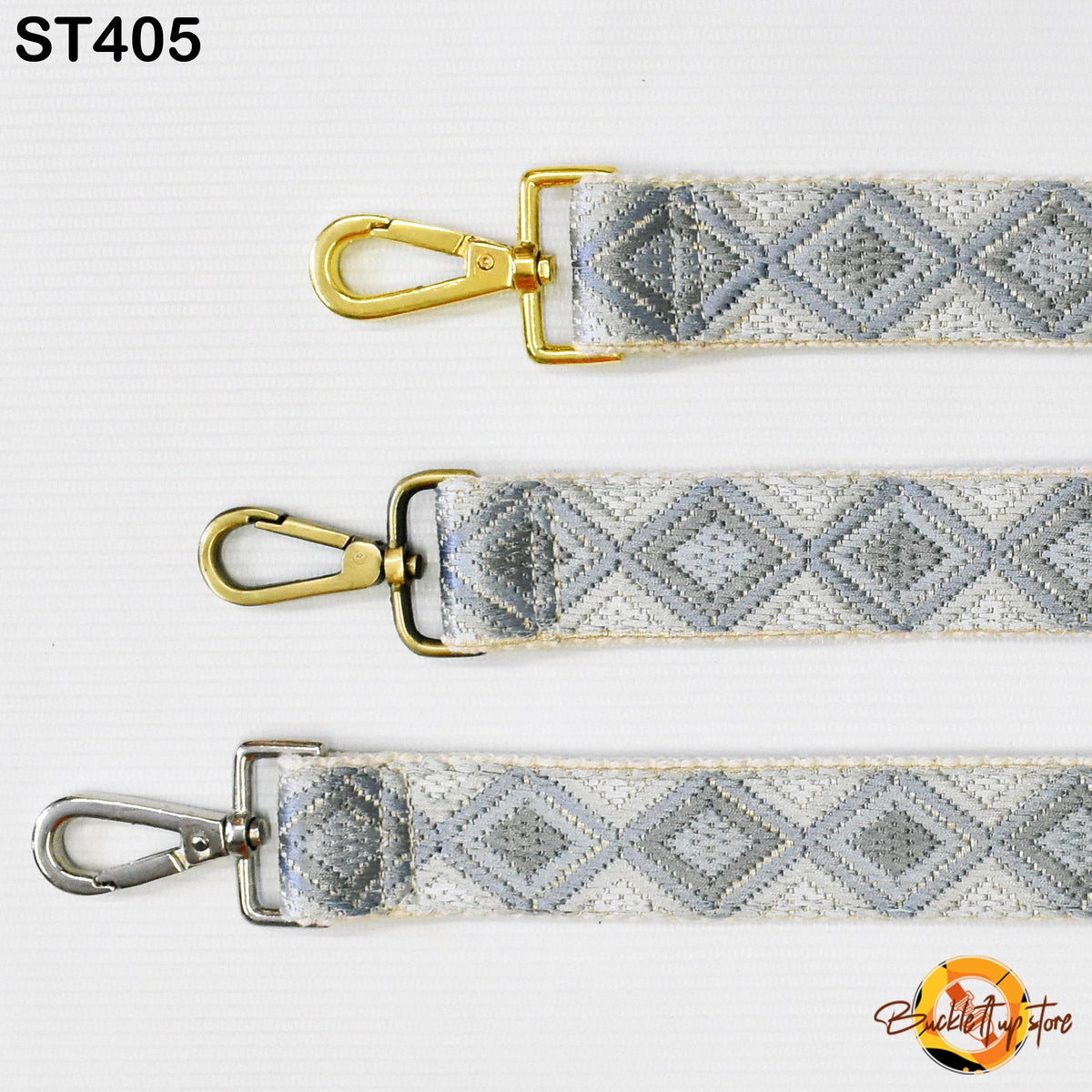 three different straps with metal hooks and a geometric pattern in shades of gray and white.