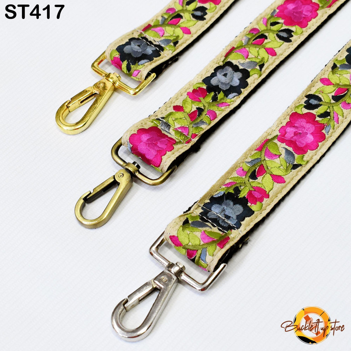 three colorful straps with floral patterns, each featuring a metal clasp and hook.