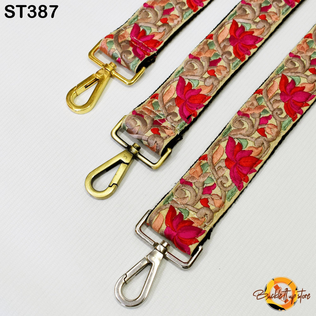 three colorful straps with floral patterns, each featuring a metal clasp and hook.