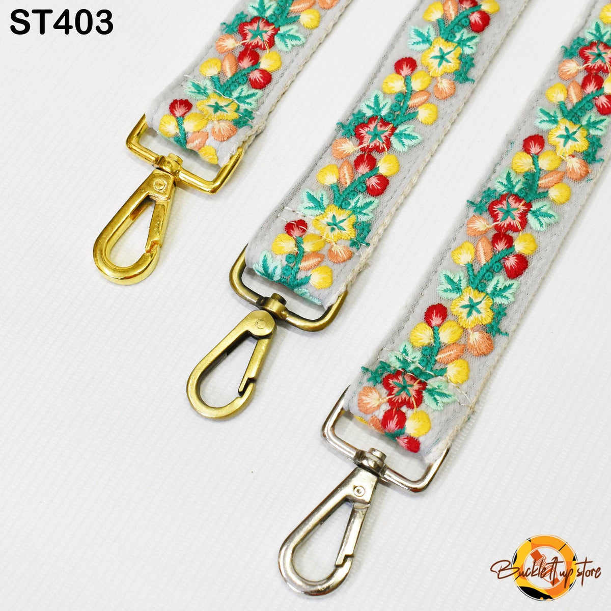 three colorful straps with floral embroidery, each with a gold-colored metal clasp.