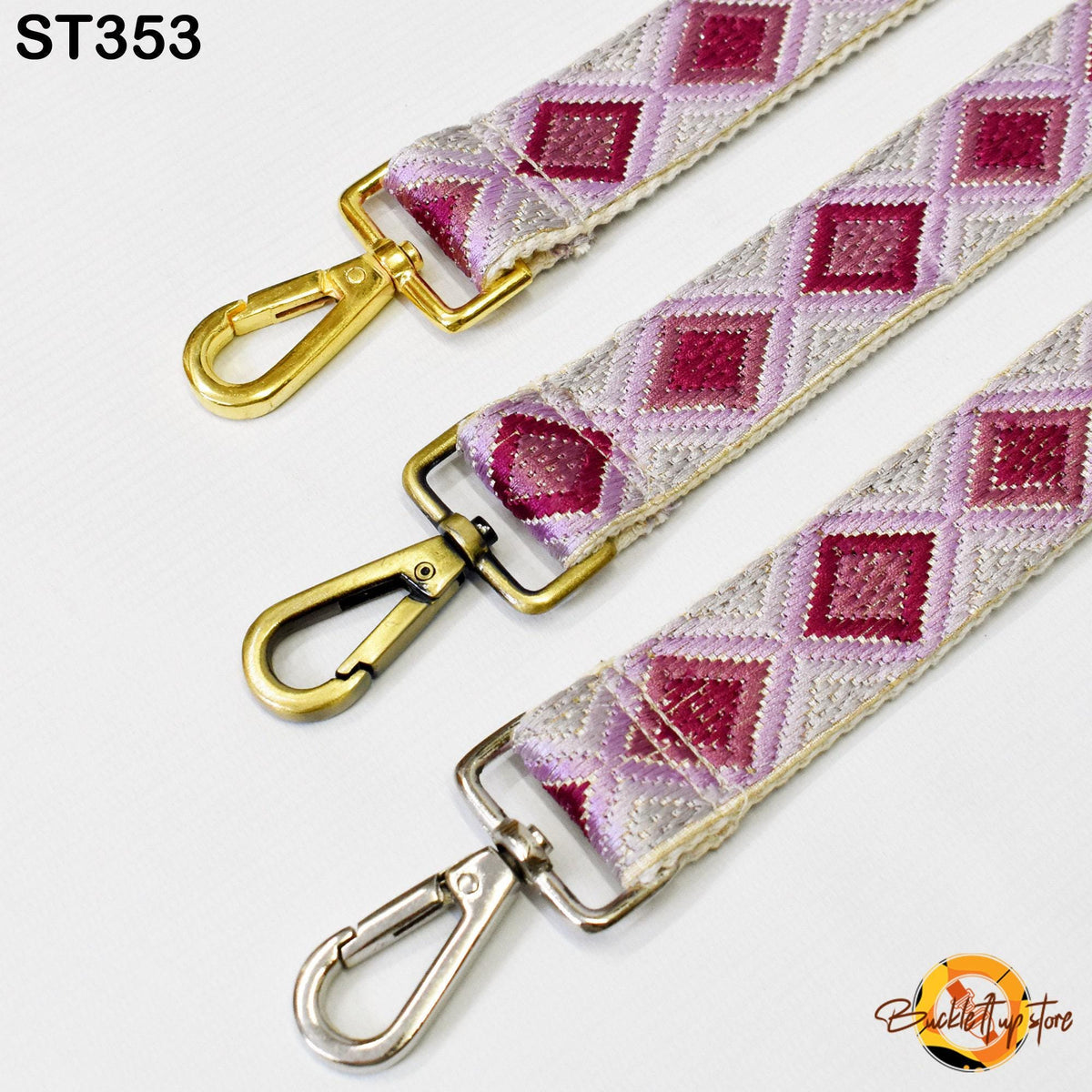 three different straps with metal hooks and buckles, arranged side by side.