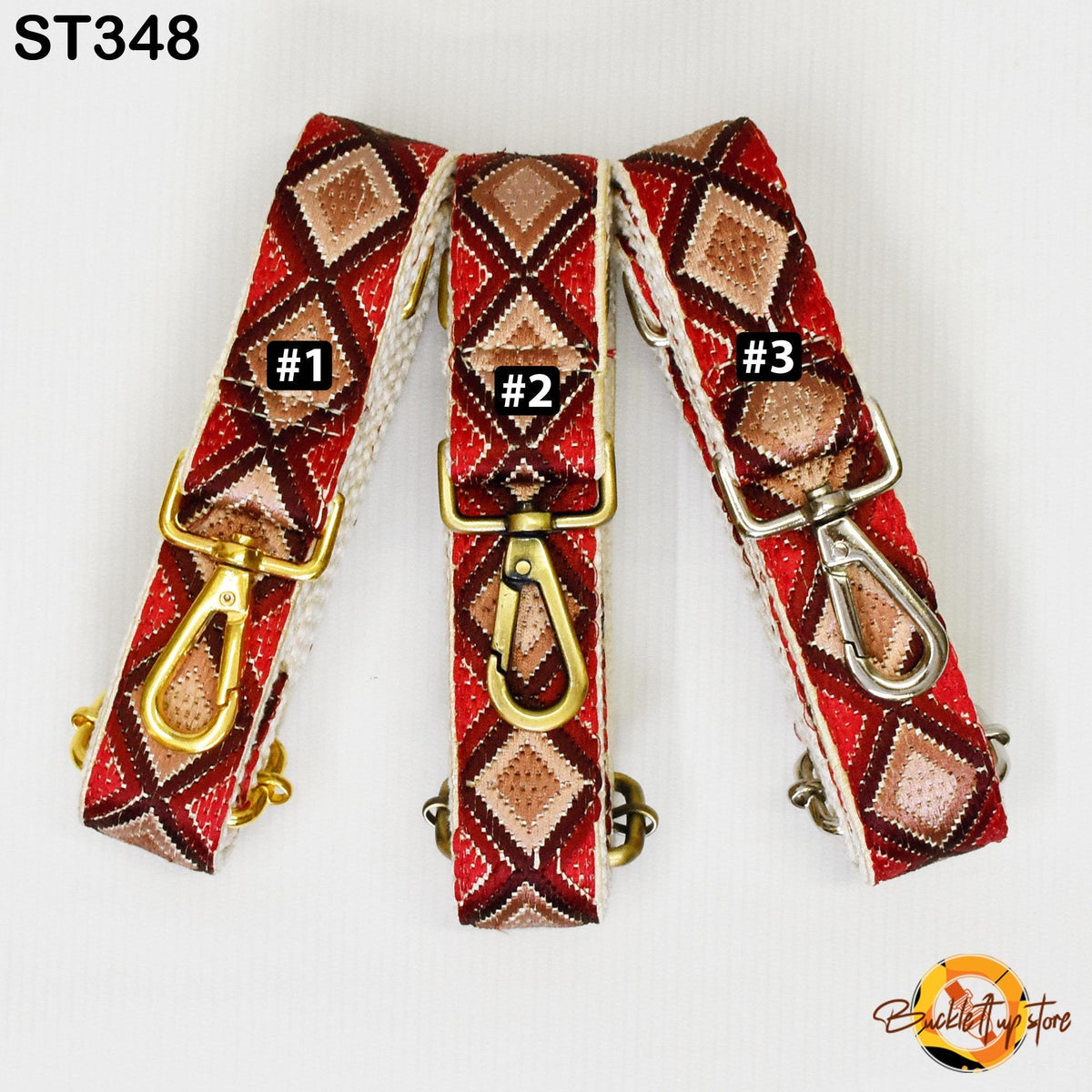 Three colorful straps with gold and red diamond patterns, each with a metal clasp and hook.