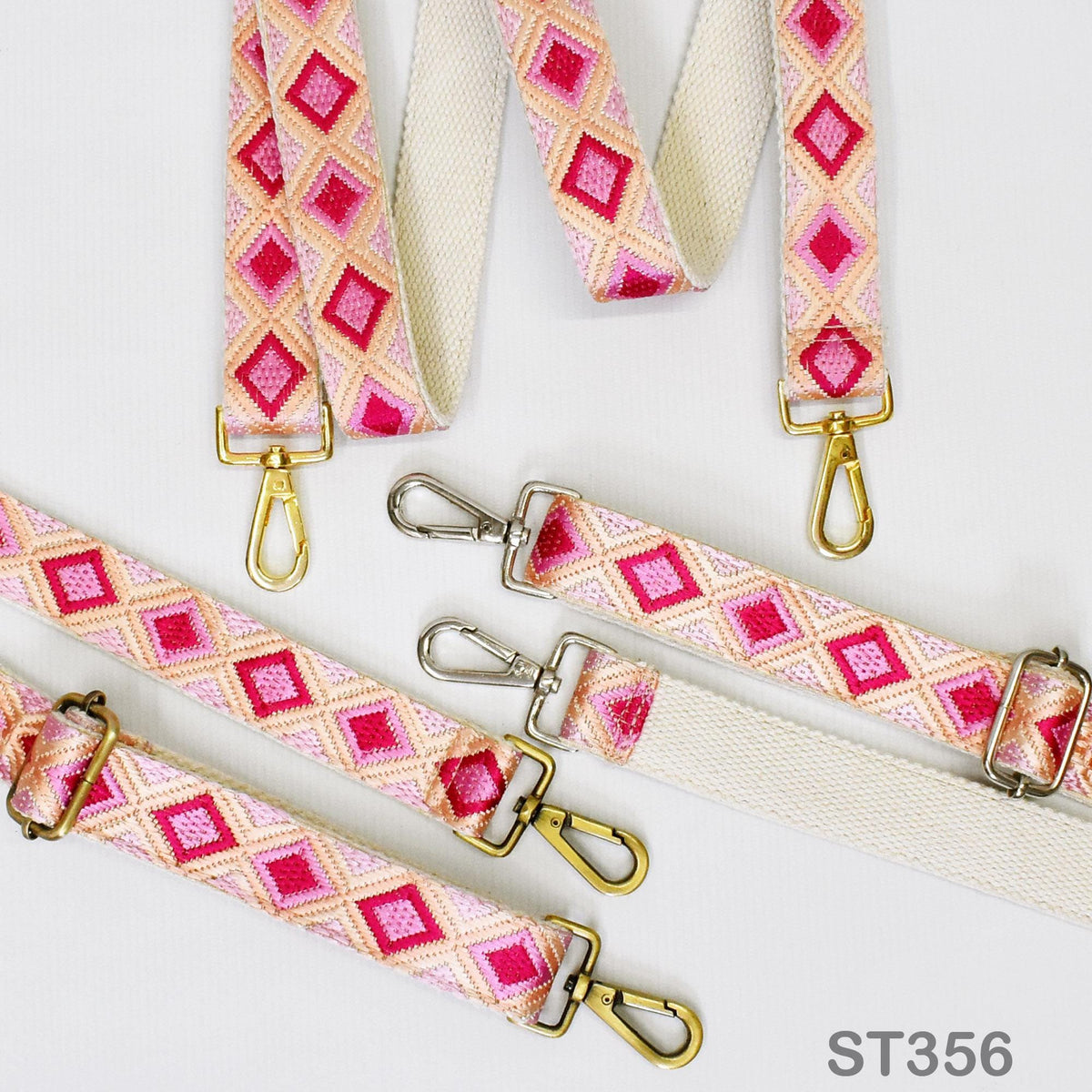 a collection of colorful straps with metal hooks, arranged on a white background.