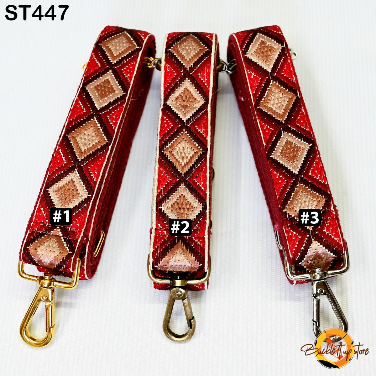Three red and gold patterned straps with numbers 1, 2, and 3 printed on them, arranged in a row.