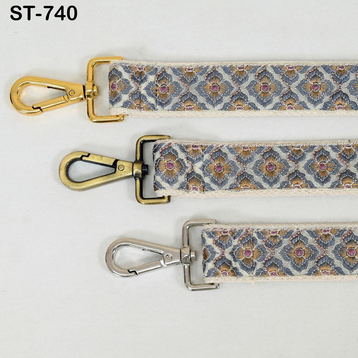three different types of metal straps with gold and silver hooks, arranged side by side.
