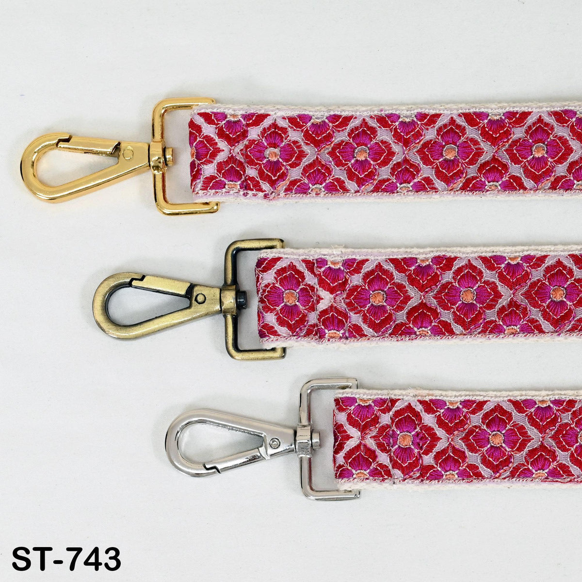 three different types of metal straps with a floral pattern, arranged side by side.