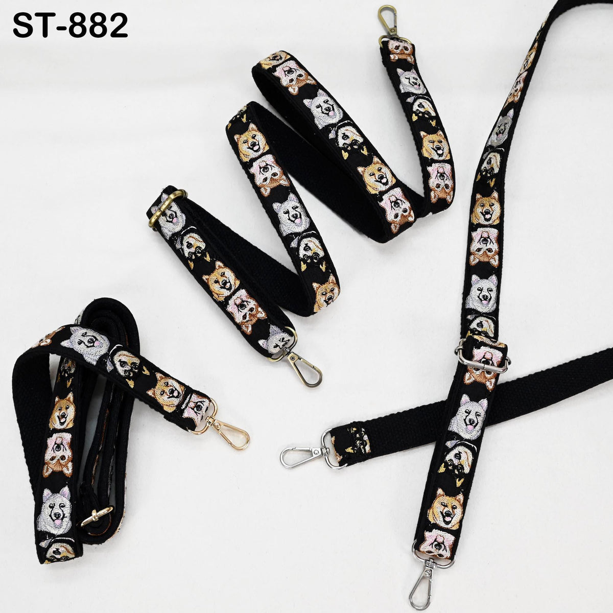 several black straps with a repeating pattern of dog faces on them. The straps appear to be made of fabric and are designed for use as a fashion accessory or a functional item.
