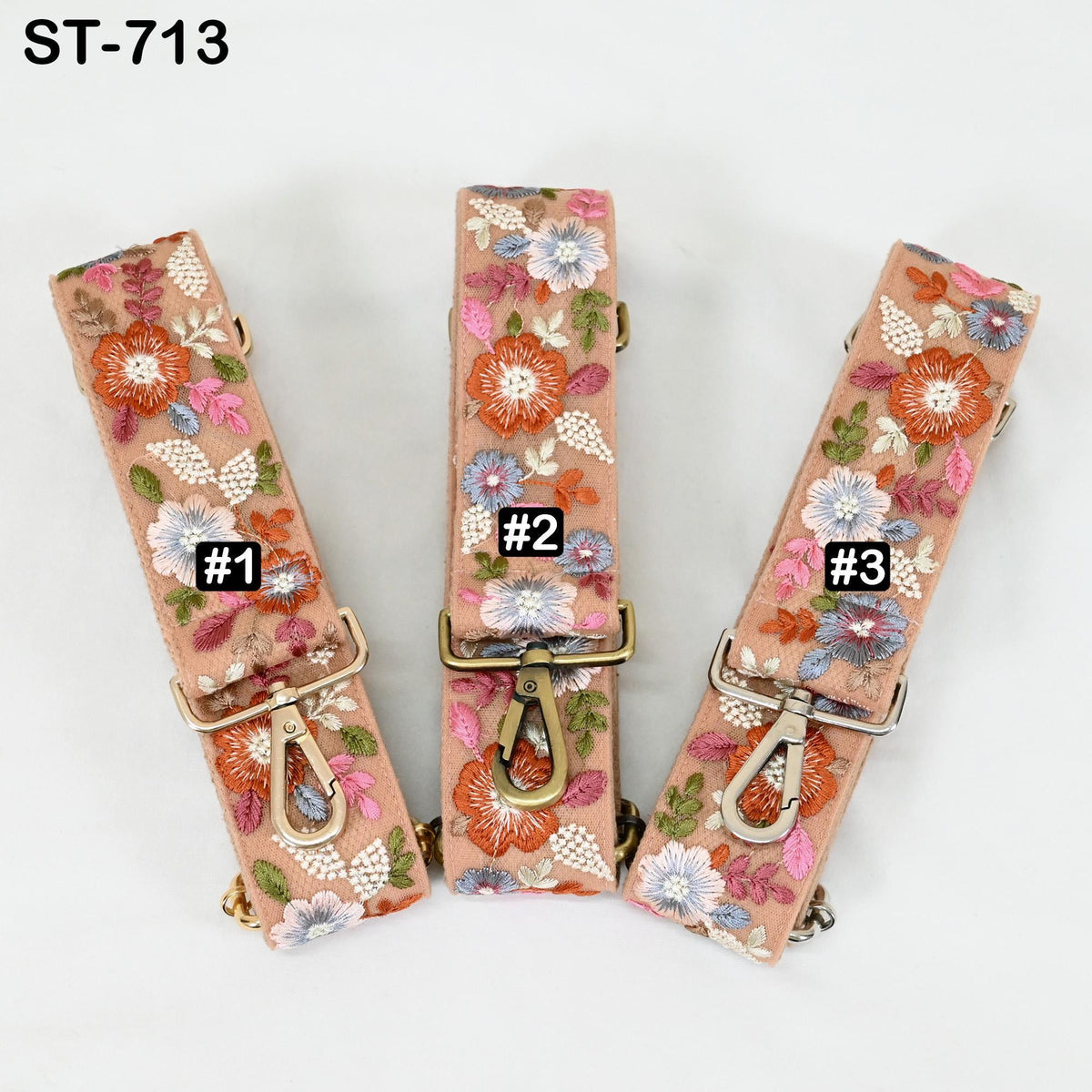 Three floral-patterned straps are displayed, each with a different number attached to it.