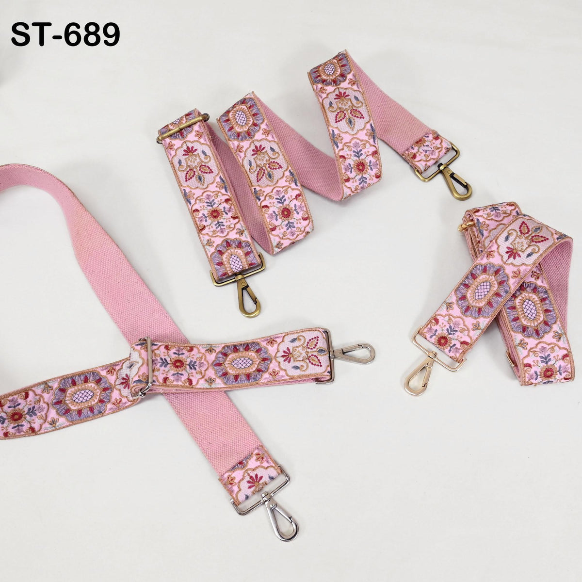 a collection of pink and white floral patterned straps, including a pink strap with a floral design and several other straps with similar patterns.