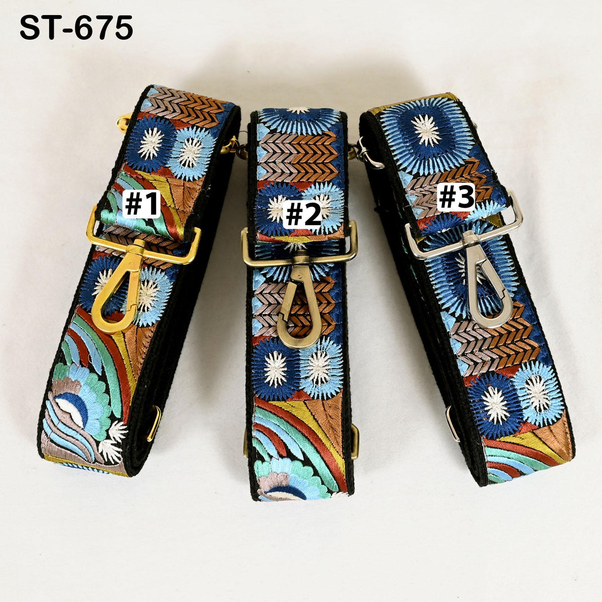 Three colorful patterned straps with numbers on them, arranged in a row.