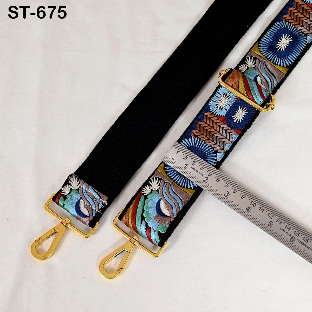 a colorful, patterned strap with a ruler placed next to it, indicating the strap's length.