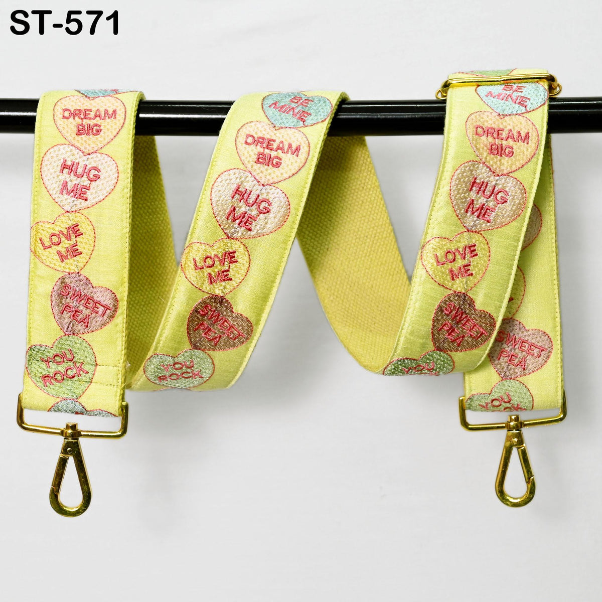 a pair of yellow lanyards with hearts on them