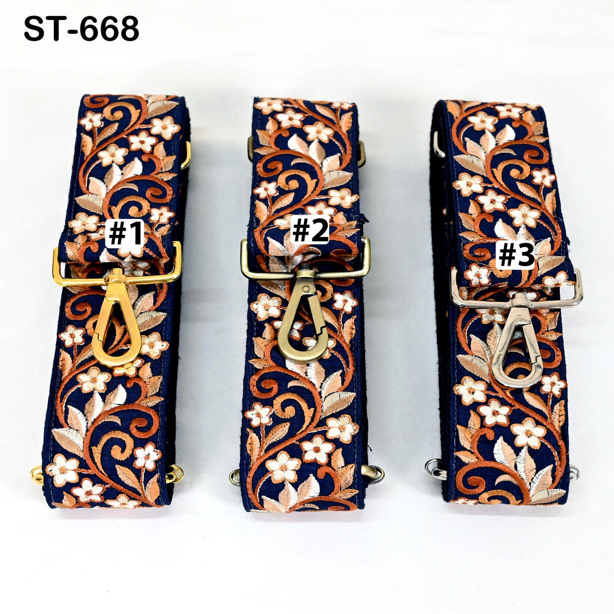 Three colorful floral straps with gold and silver hardware, each with a unique number label.