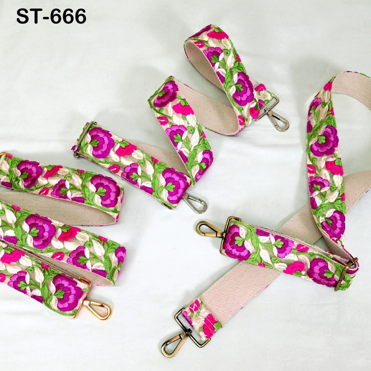 a collection of colorful floral straps, including pink and green straps with flower patterns, arranged on a white background.