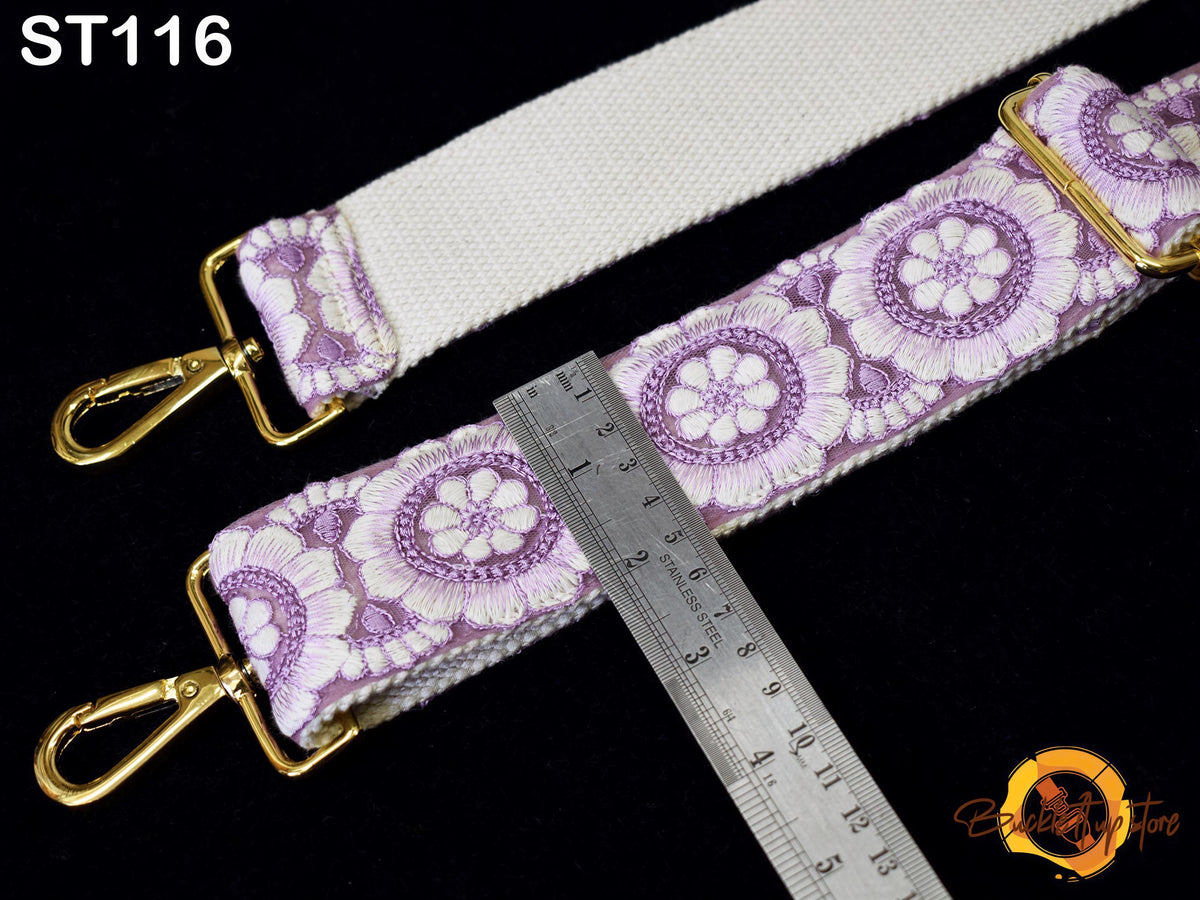 a strap with a floral pattern, and a ruler is placed next to it, indicating the strap's length.