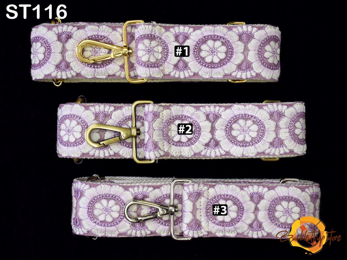 three straps with a floral pattern in shades of purple and white. Each strap has a gold clasp and a small black label with the number "#1", "#2", and "#3" printed on it.