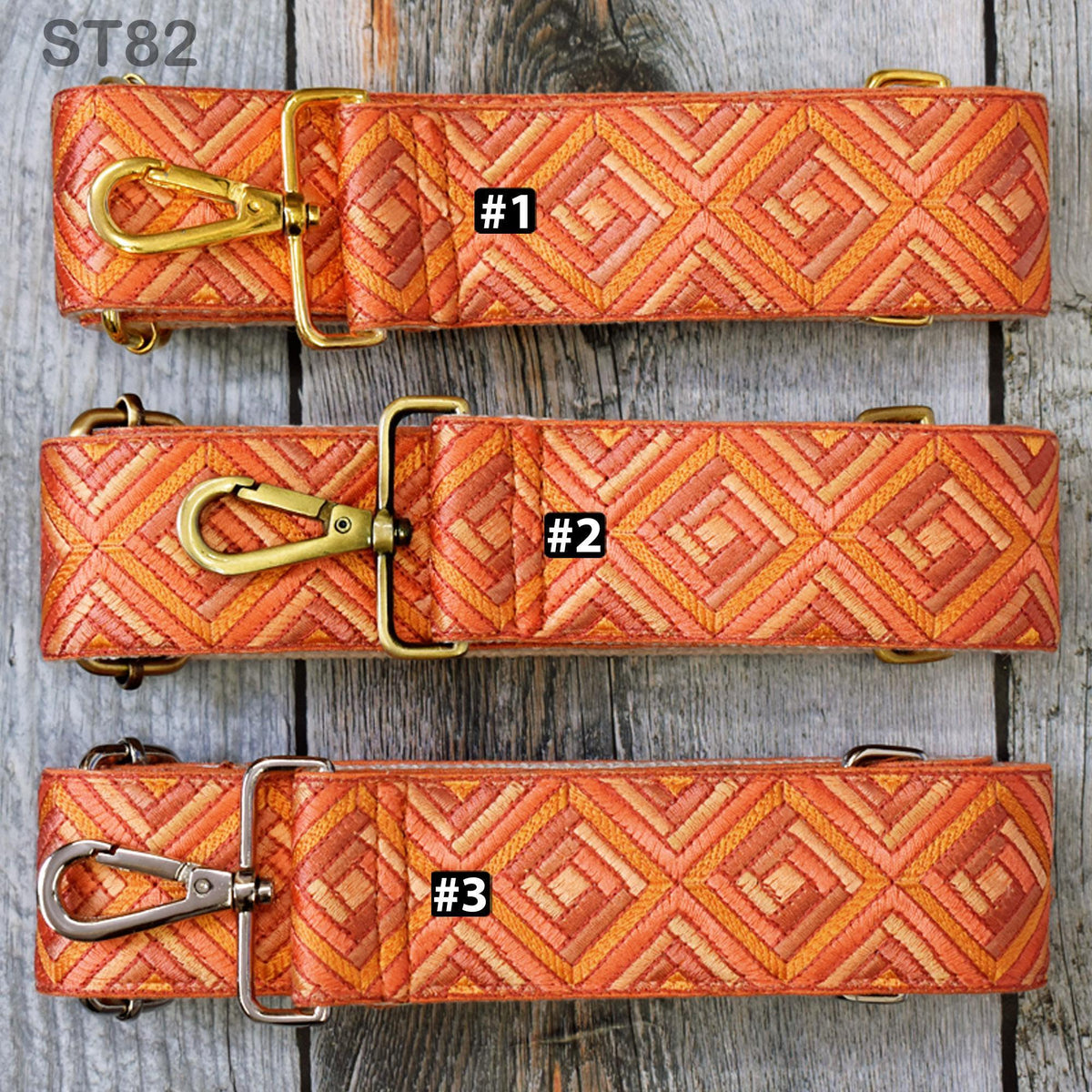three straps with different patterns, arranged on a wooden surface.