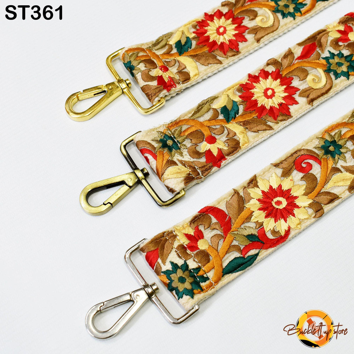 three colorful straps with floral patterns, each featuring a metal clasp and a gold-colored metal loop.