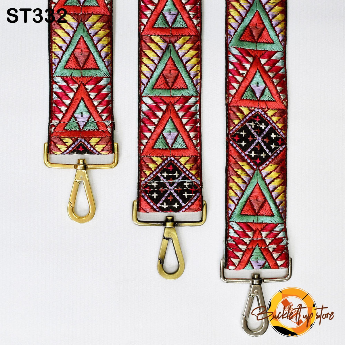 three colorful, patterned straps with metal hooks, arranged side by side.