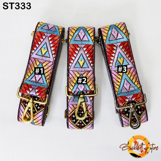 Three colorful, patterned straps with numbers on them, arranged in a row.