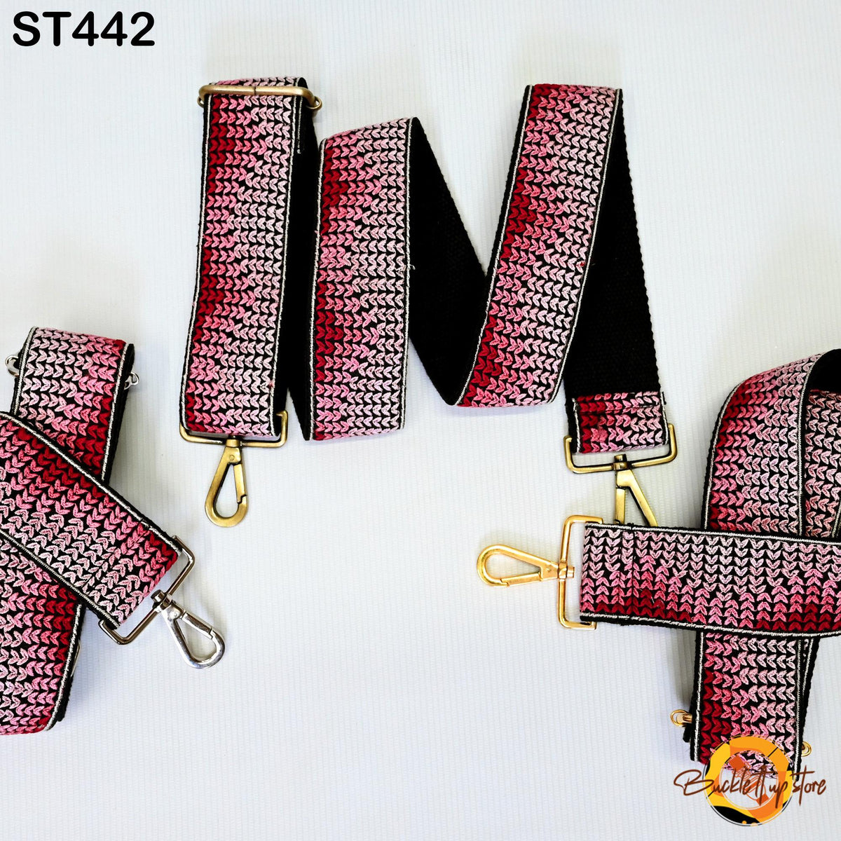 a collection of colorful, knitted straps in shades of pink and red, arranged in a circular pattern.