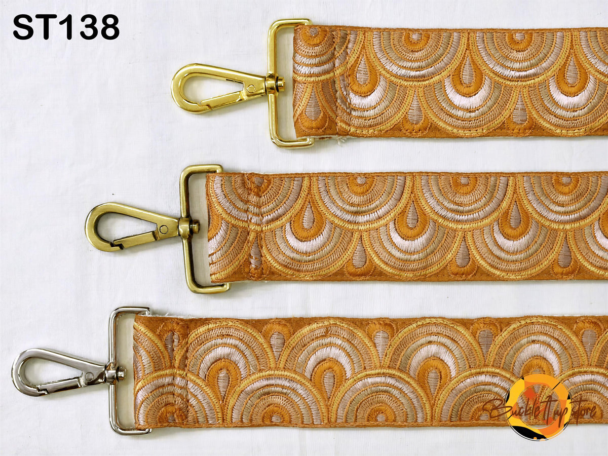 three straps with a repeating pattern of gold and white circles, arranged in a row.