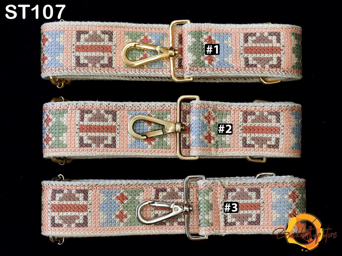 three colorful, patterned straps with metal buckles, each with a unique number printed on it.