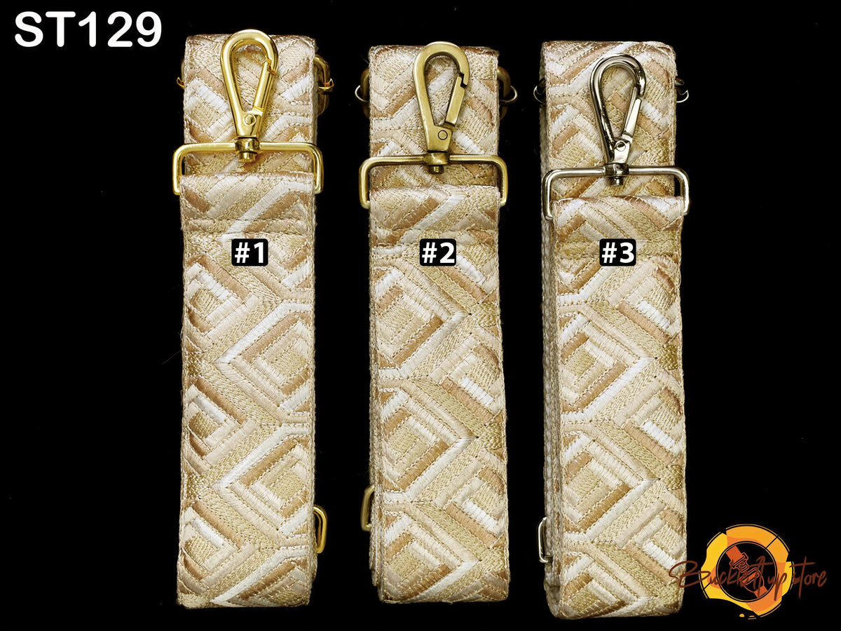 Three beige patterned straps with gold hardware, each labeled with a number.