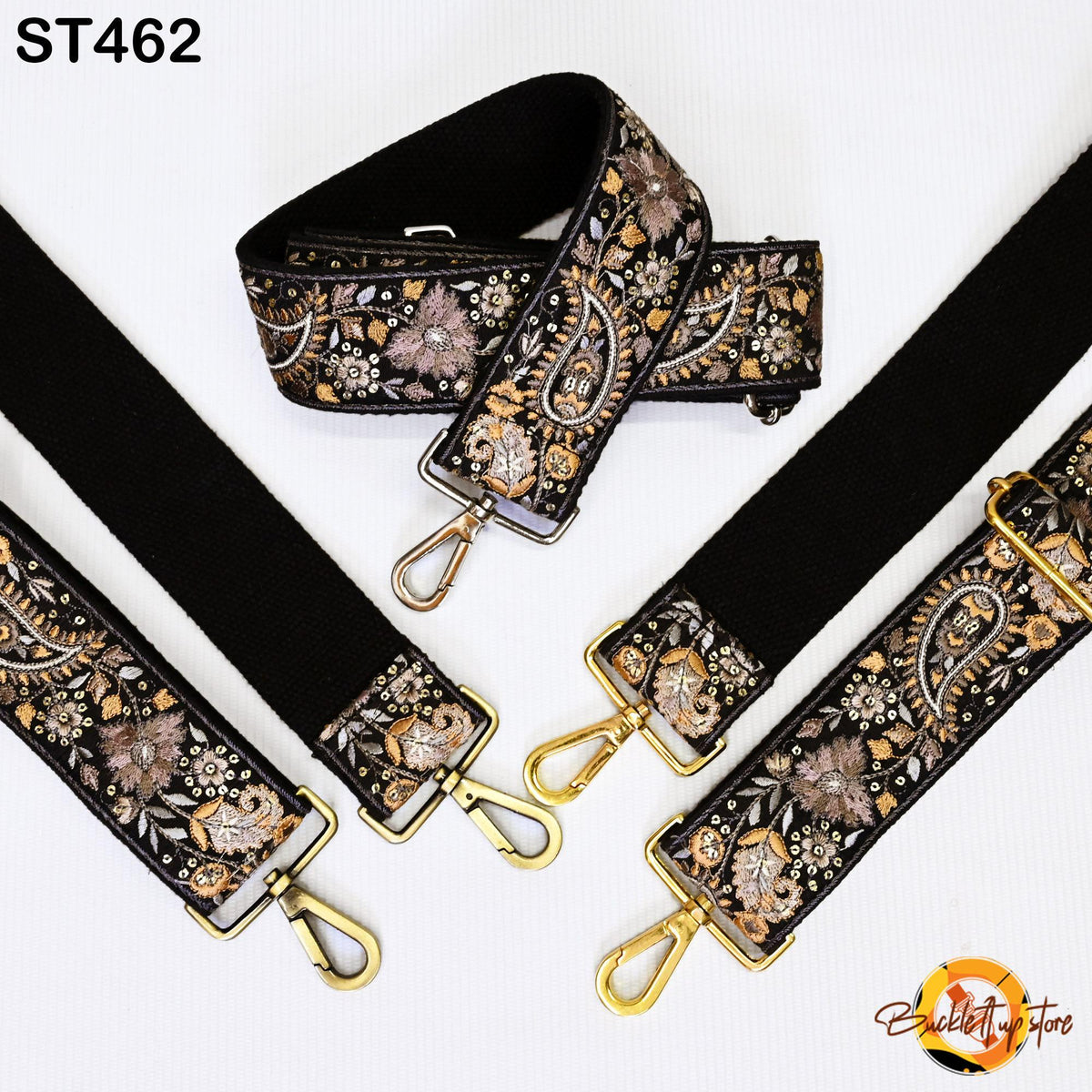 a collection of black and gold embroidered straps, each with a gold metal buckle, arranged on a white background.