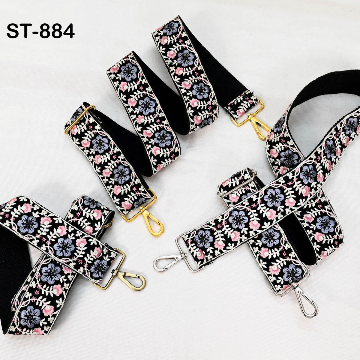 A collection of patterned straps with floral designs, including a black strap with a floral pattern and a silver strap with a floral pattern.
