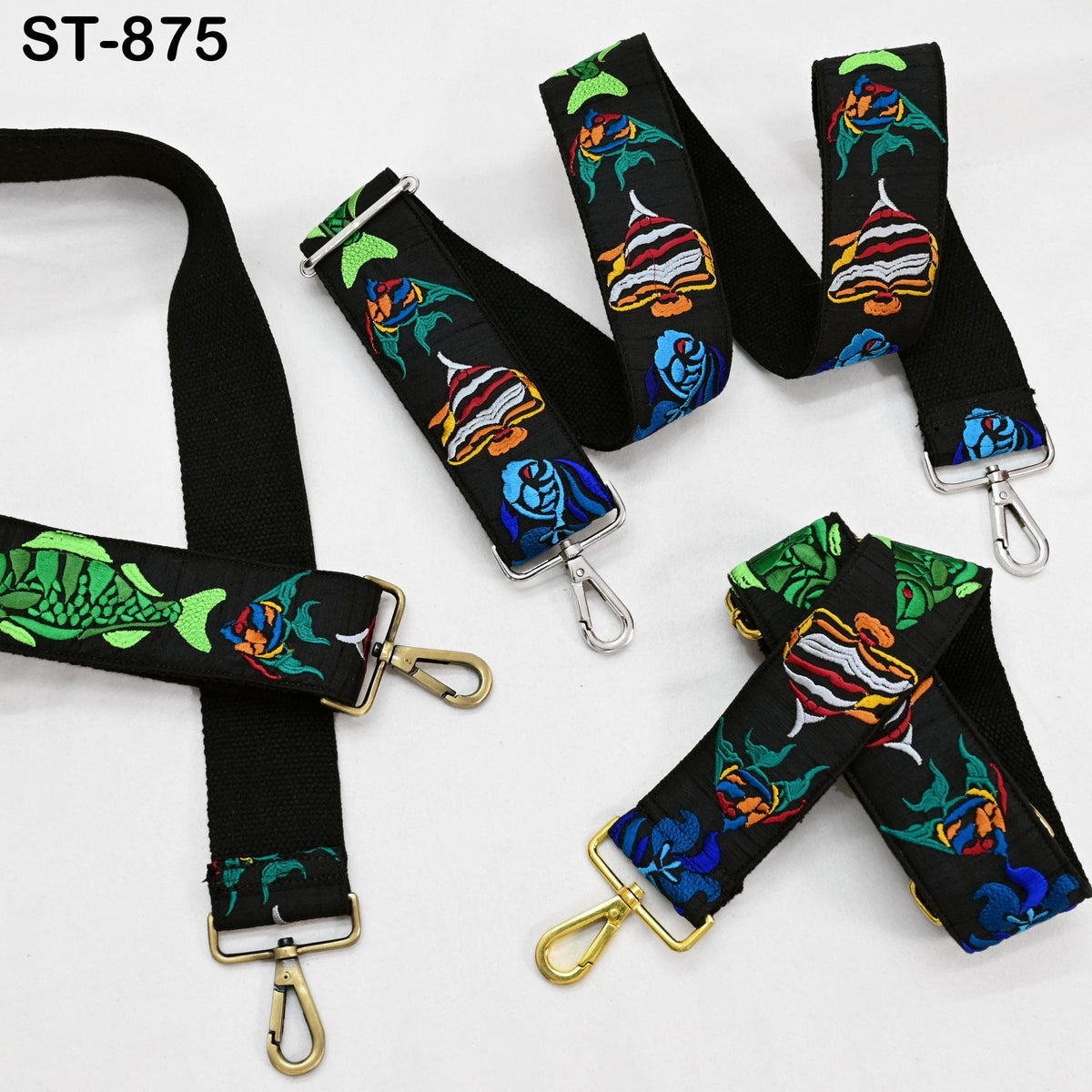 a collection of colorful, patterned straps or straps with various designs, including fish and floral motifs, arranged on a white background.