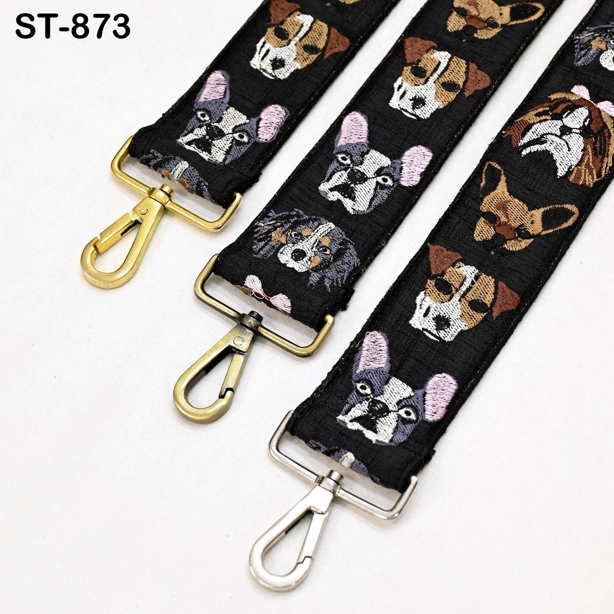 three straps with dog faces printed on them, arranged in a row.