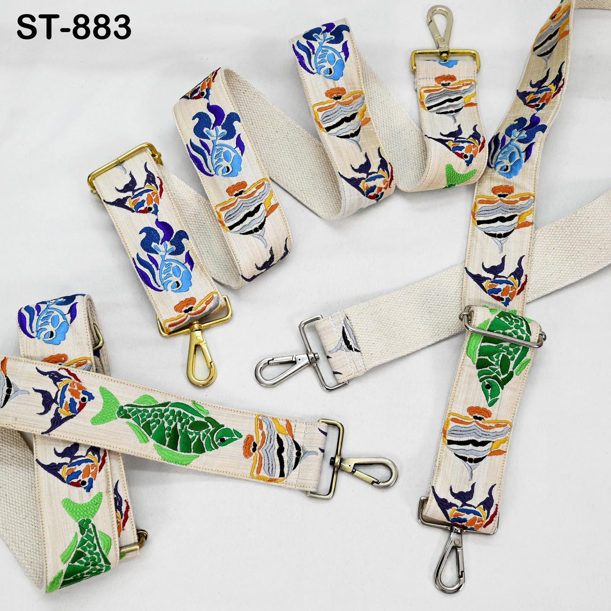 a collection of colorful, patterned straps with various designs, including fish and marine motifs.